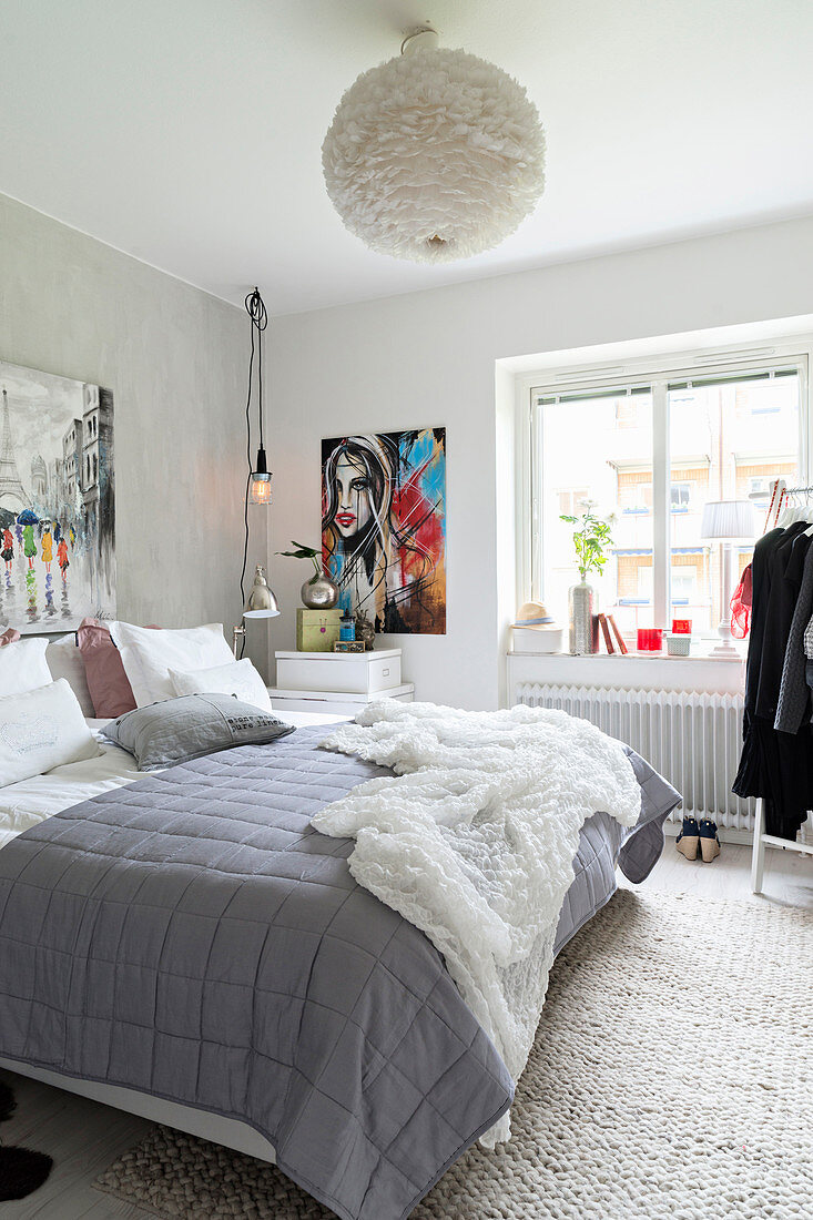 Blanket on bed in bright bedroom