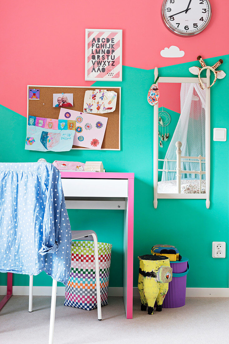 Child's bedroom with bicoloured walls in mint and pink