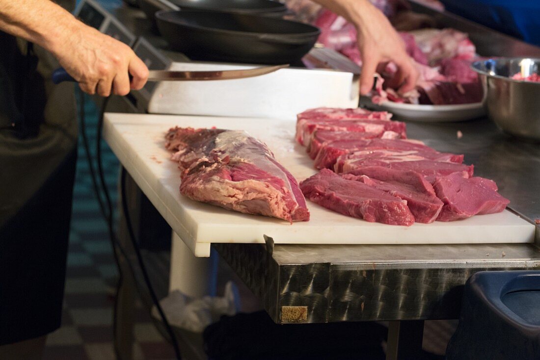 Steaks being cut