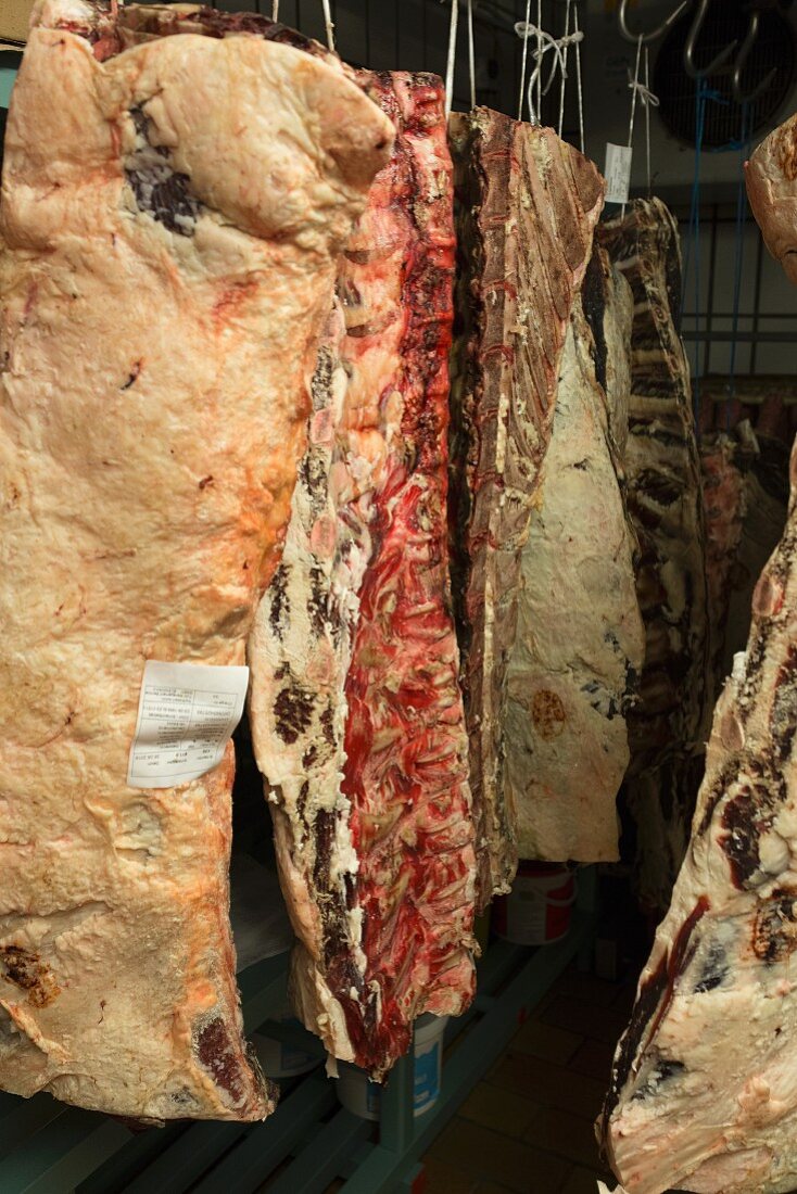 Cow halves in a refrigerated warehouse