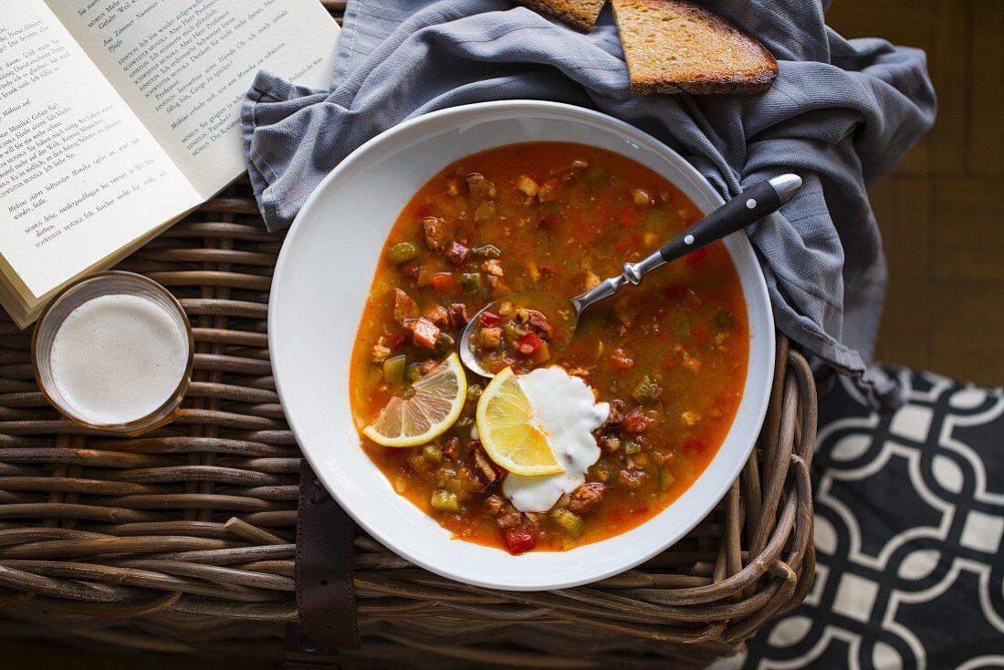 Solyanka soup with sour cream and lemon