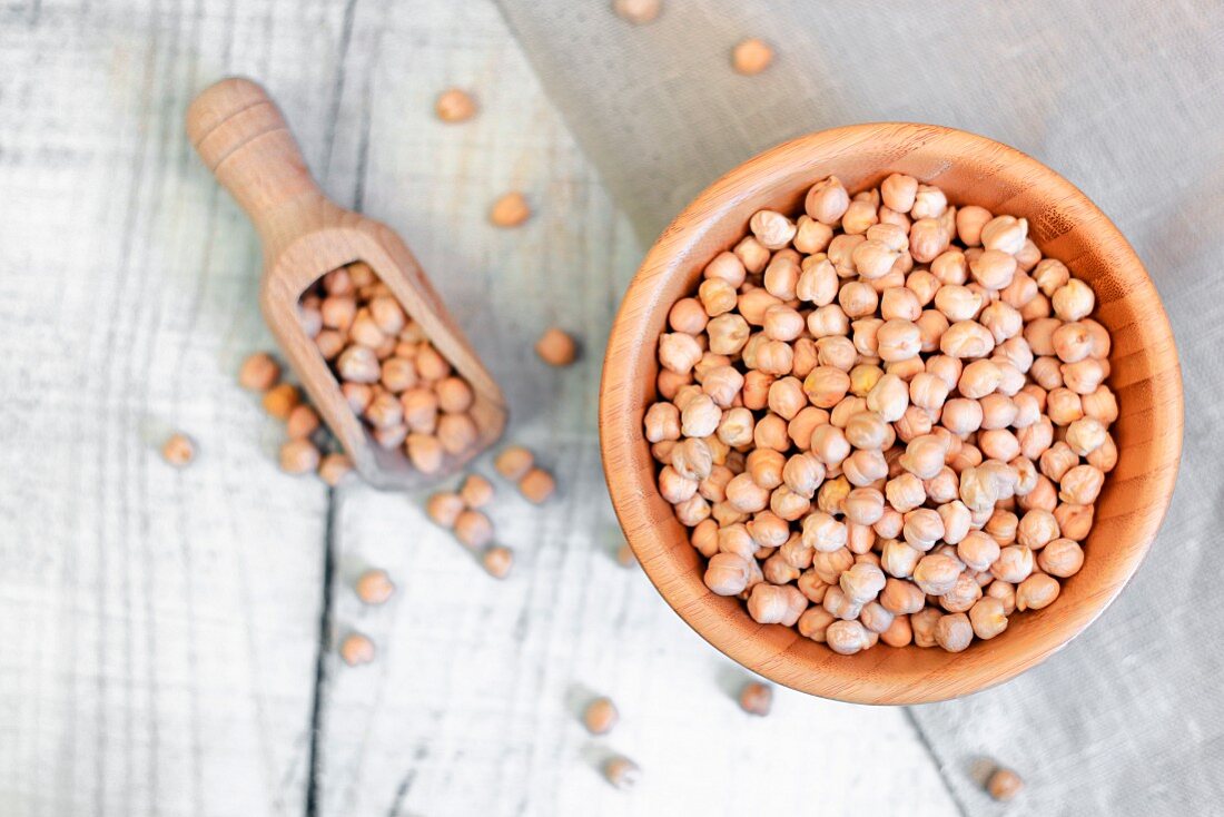 Dried chickpeas in a wooden bowl