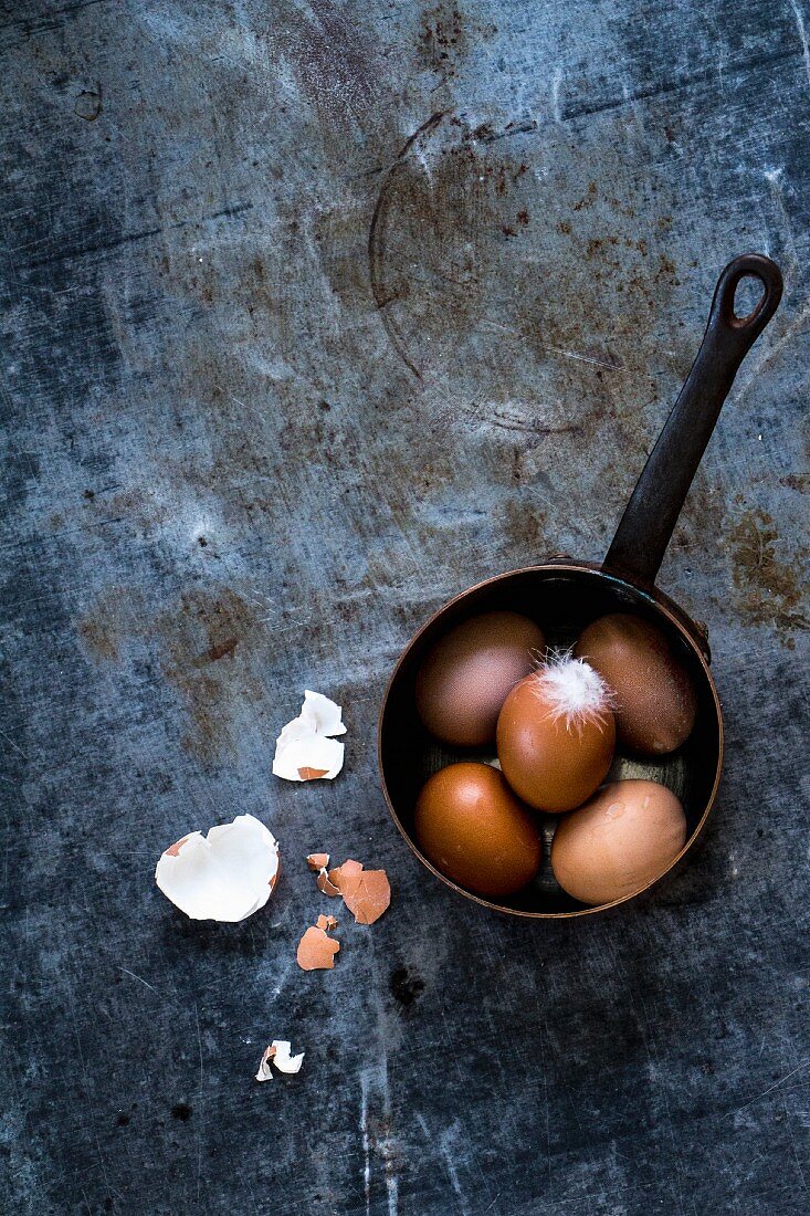 Brown eggs in a saucepan