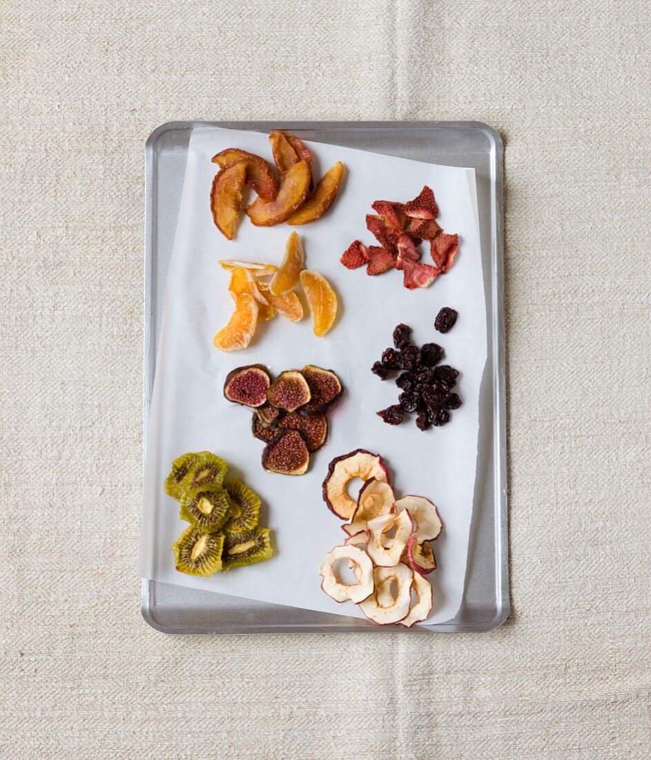 Various dried fruits on a baking tray