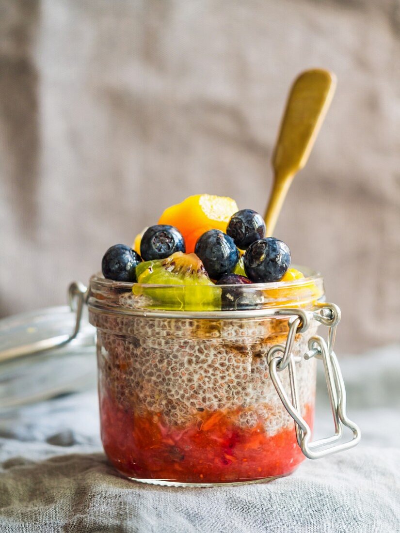 Overnight chia pudding with red fruit mousse and fesh fruit