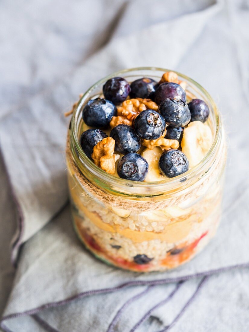 Breakfast quinoa with fresh fruit, fruit mousse and peanut butter