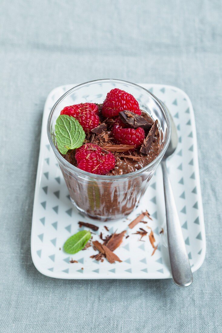 Vegan chia chocolate pudding with raspberries