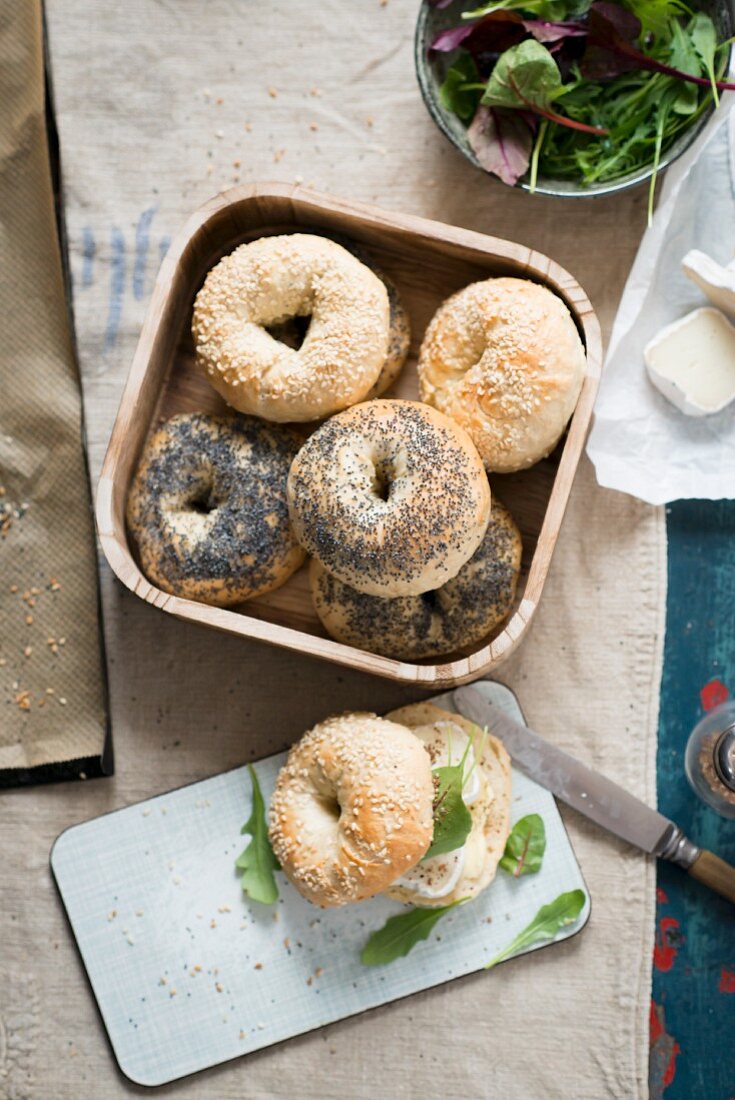 Various bagels with cheese and lettuce