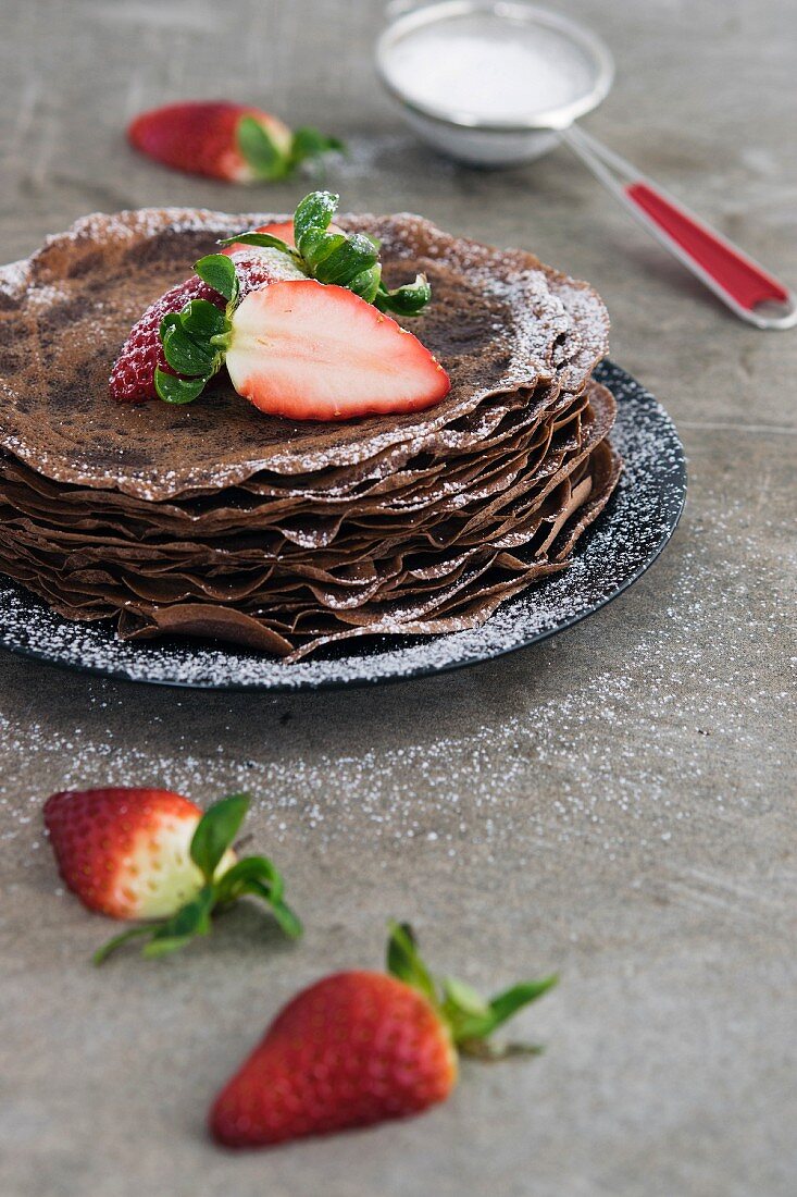 Chocolate Crepes with Strawberry and Icing Sugar