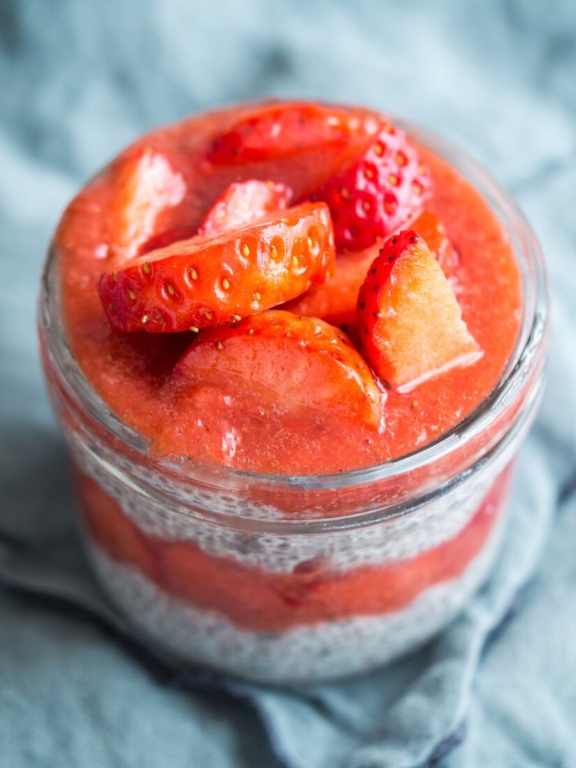 Overnight chia pudding with strawberry mousse and fresh strawberries
