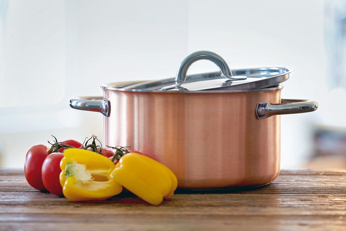 A copper, aluminium and stainless steel saucepan made by Schulte-Ufer