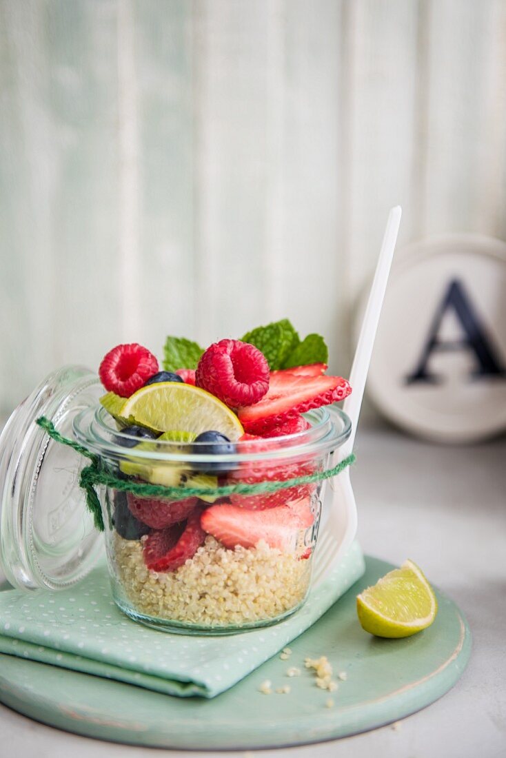 Fruit salad with quinoa in a jar for lunch