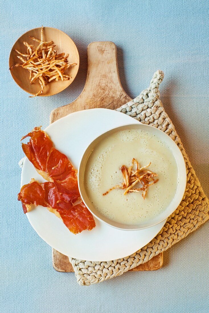 Celery and prosecco soup with serrano chips