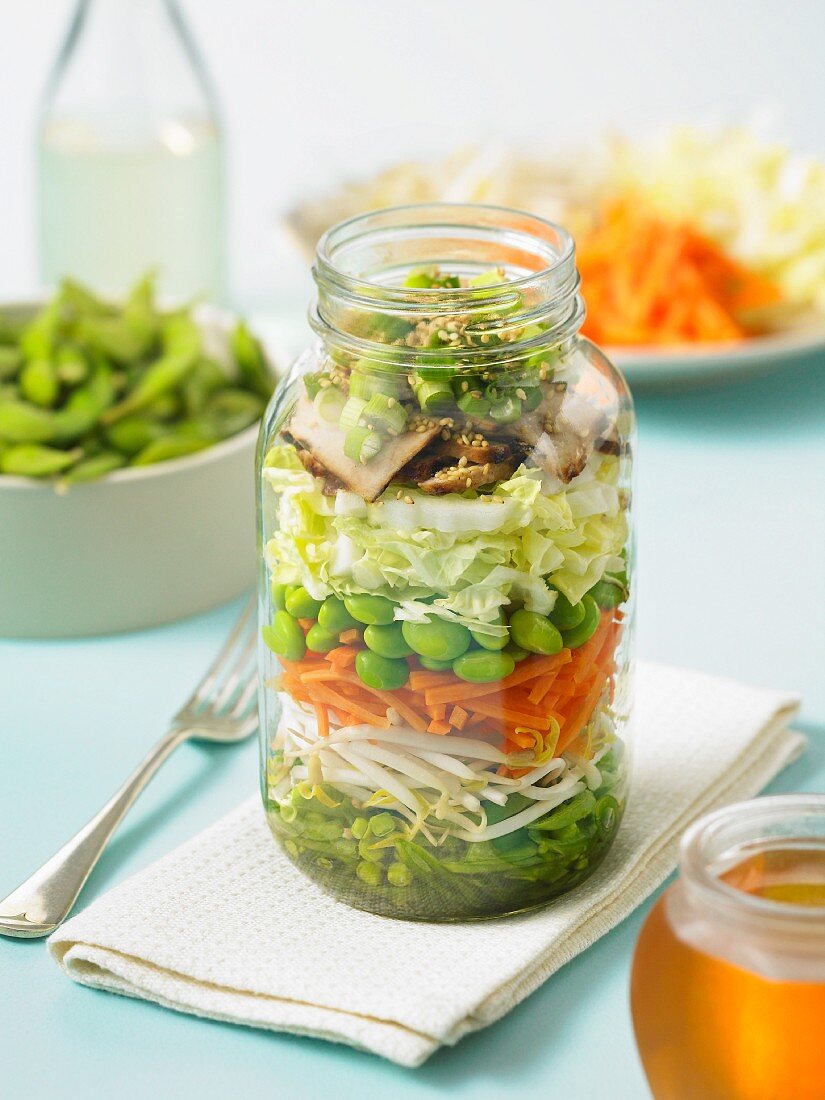 Layered salad with shoots, carrots and soya beans (Asia)
