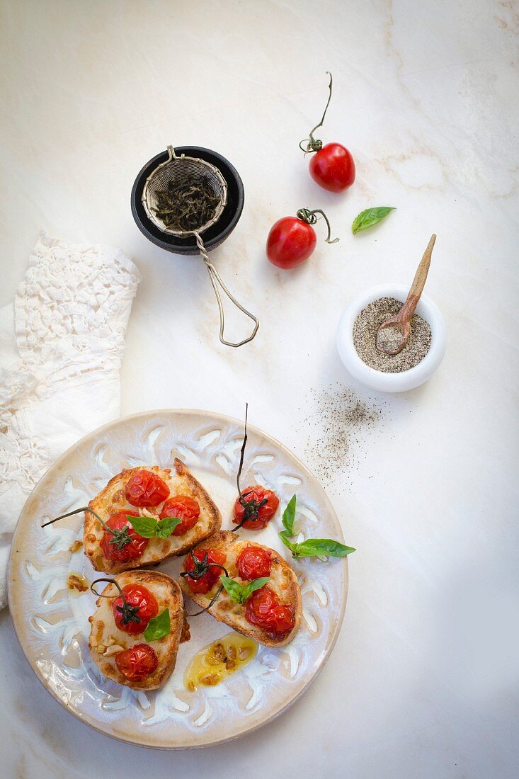 Bruschetta caprese with roasted grape tomatoes and garlic
