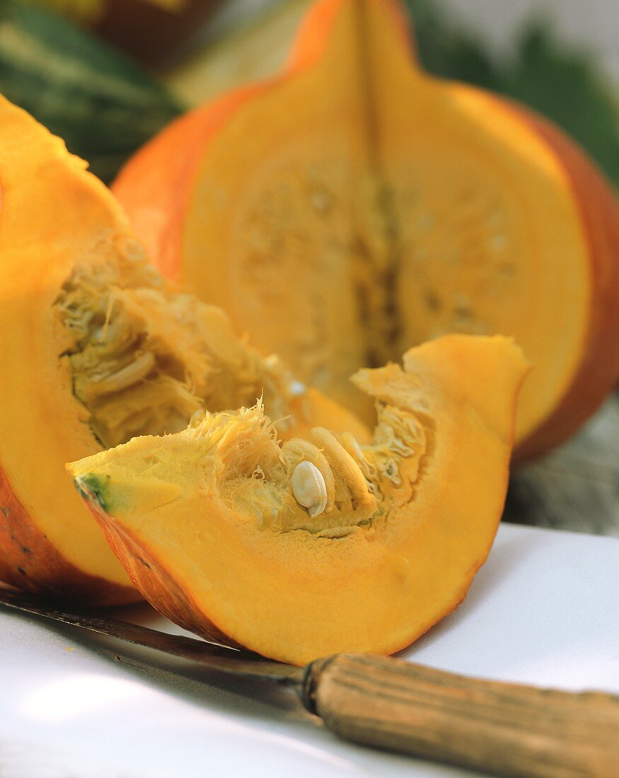 An orange pumpkin (Hokkaido), cut open