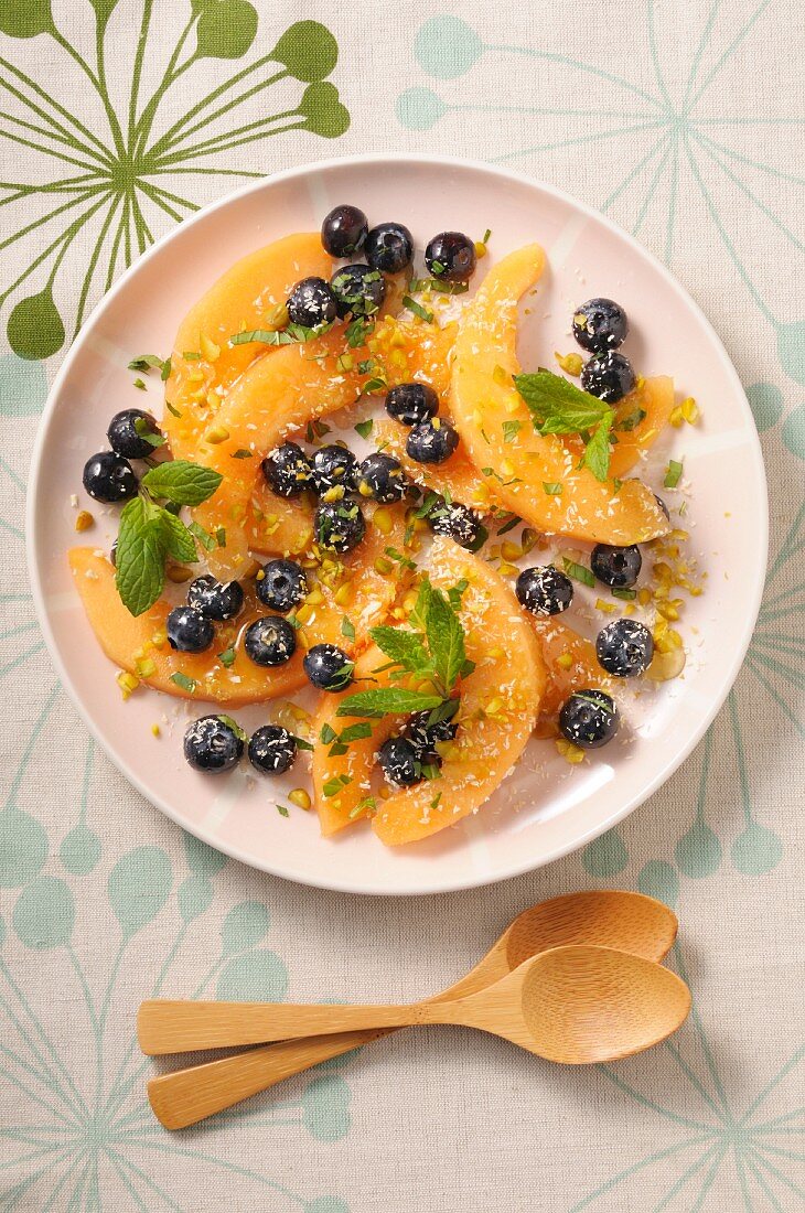 A melon salad with blueberries and mint