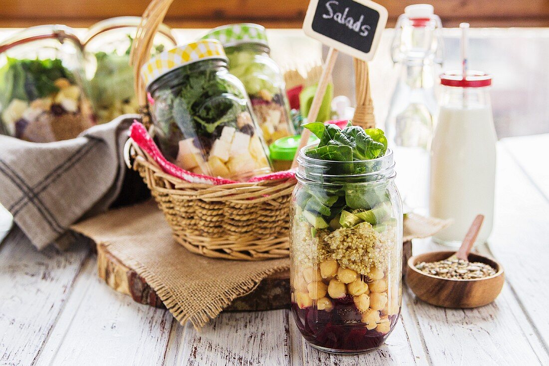 Different salads in jars prepared for a brunch in a buffet