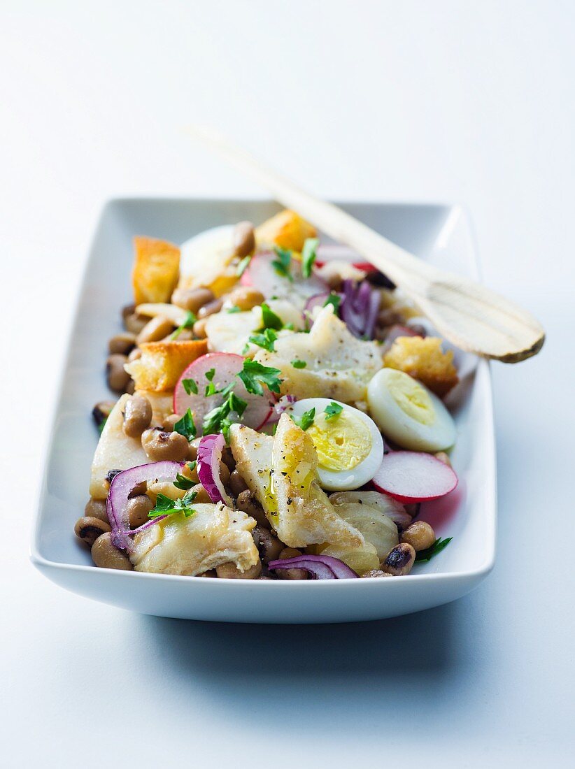 Cod salad with hard boiled eggs, radishes and black-eyed peas