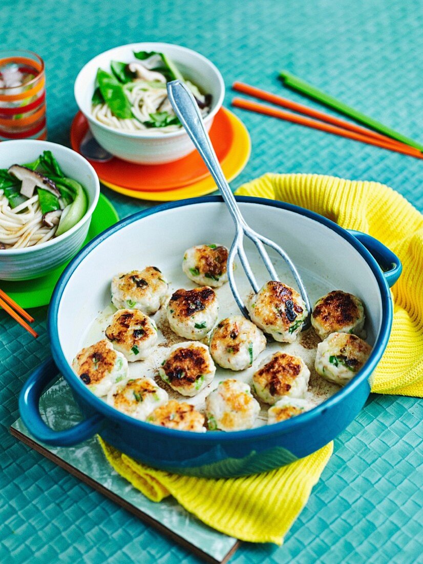 Prawn and fish balls with ginger broth and noodles