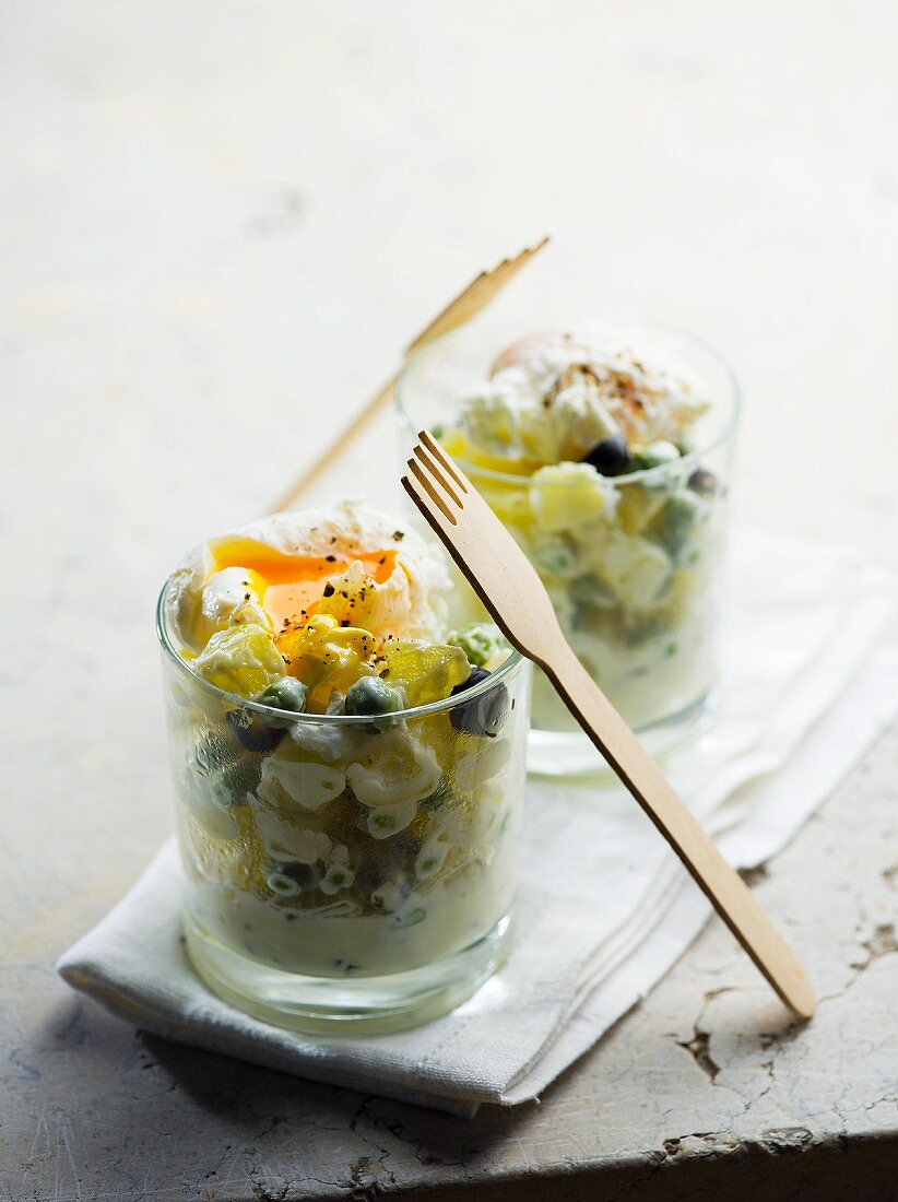 Russian salad with poached eggs