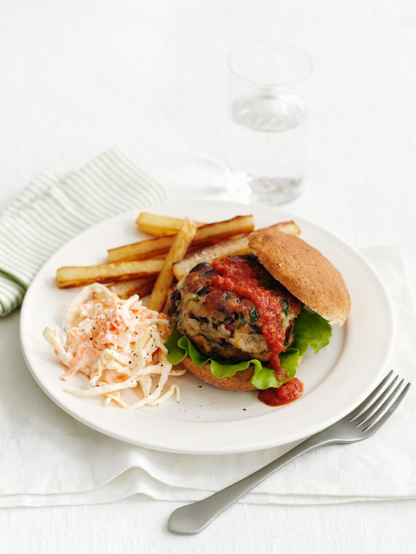 A beanburger with french fries and coleslaw (Cajun cuisine)