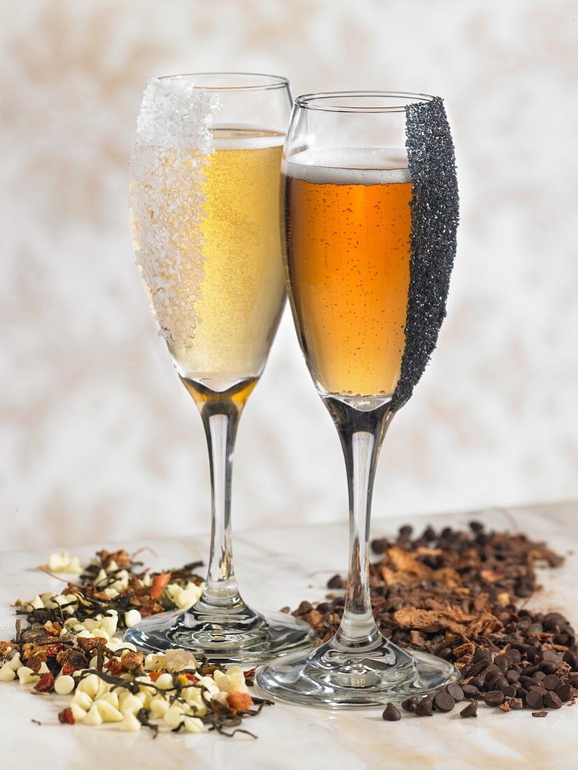 Two champagne glasses with sugar and chocolate chips