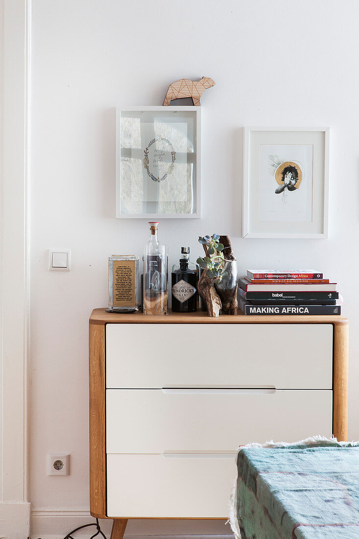 Bottles and books on cabinet