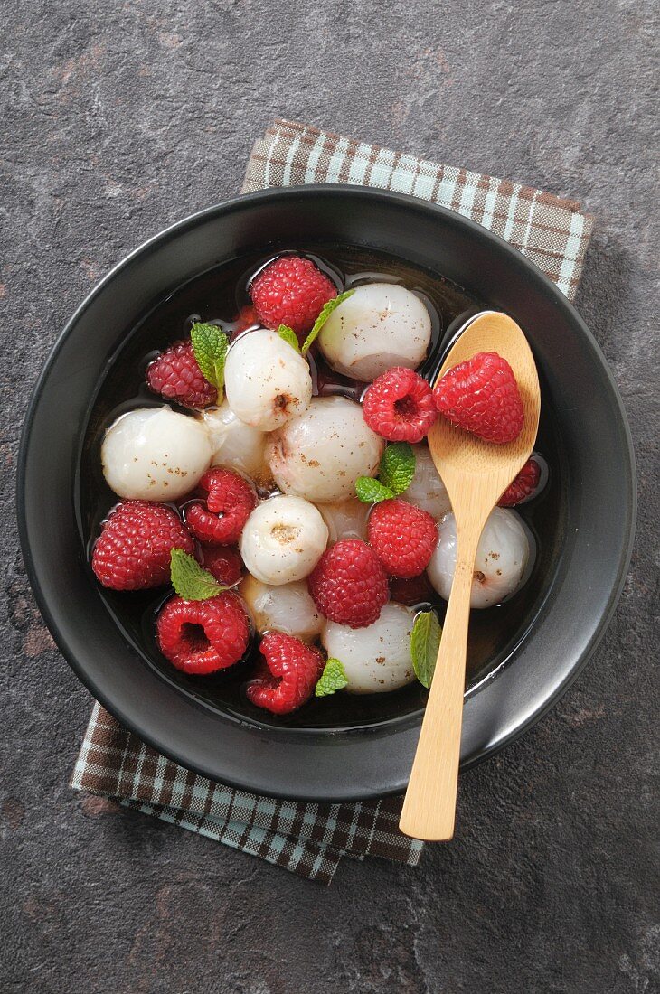 Lychees and raspberries in champagne sauce