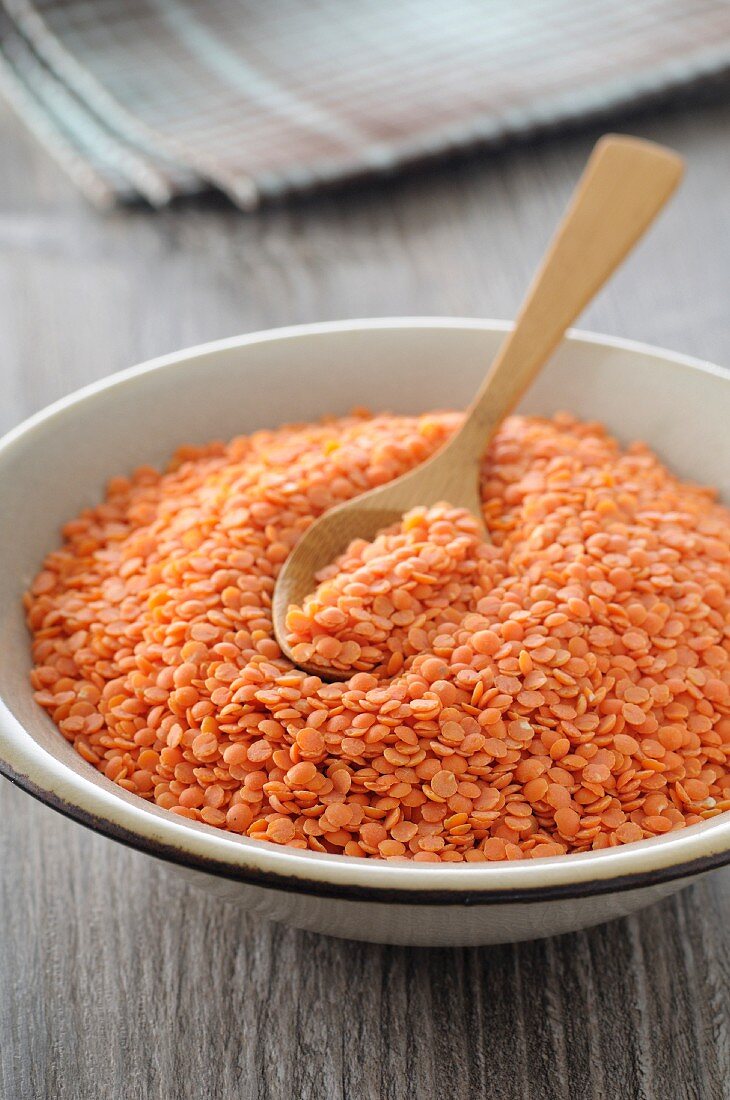 Red lentils with a spoon in a bowl