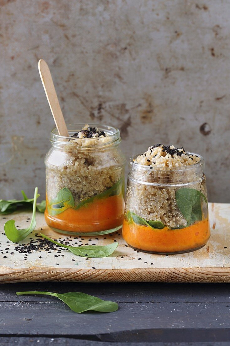 Quinoa with carrot cream in glass jars