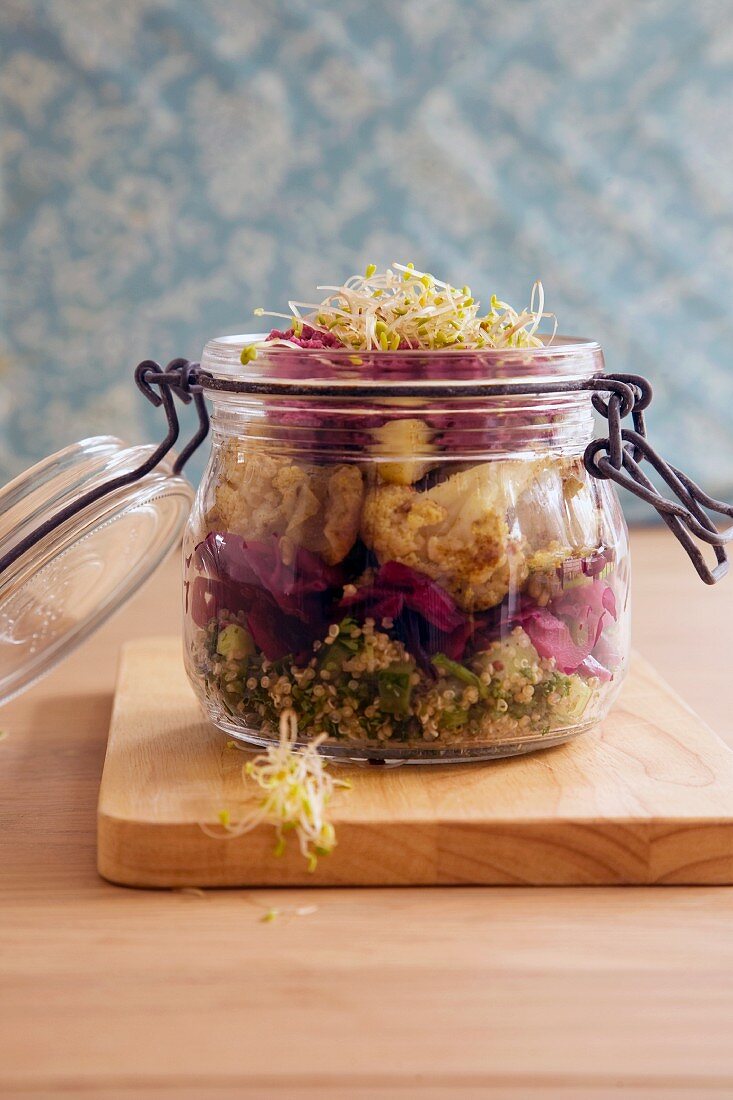Lunch in a jar: vegan salad served in a glass jar