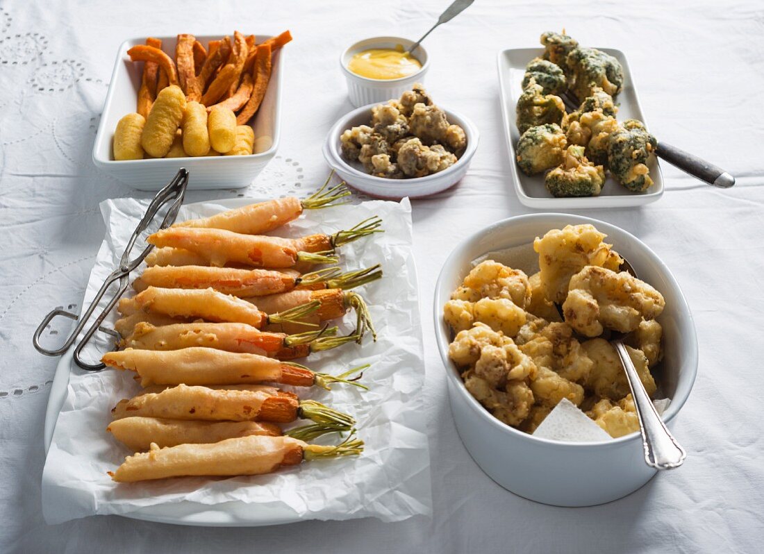 Beer batter vegetables served with croquettes and sweet potato fries with dip (vegan)