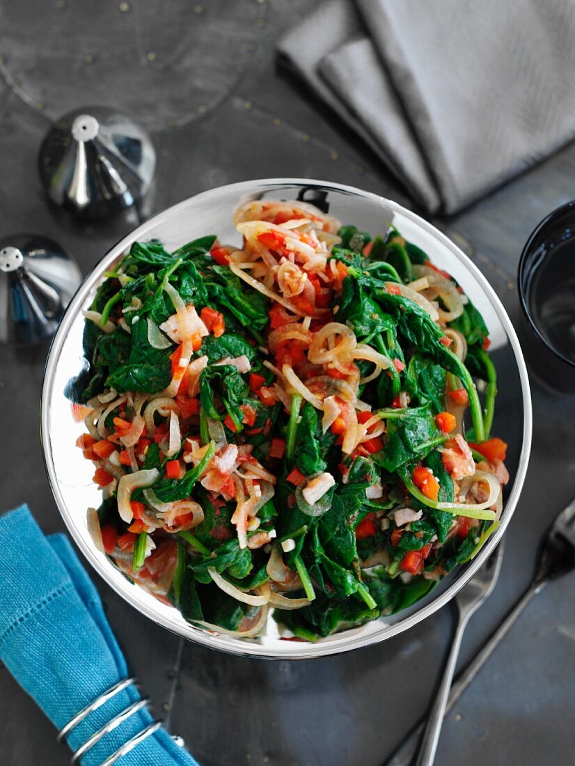 Sautéed spinach with bacon and tomatoes