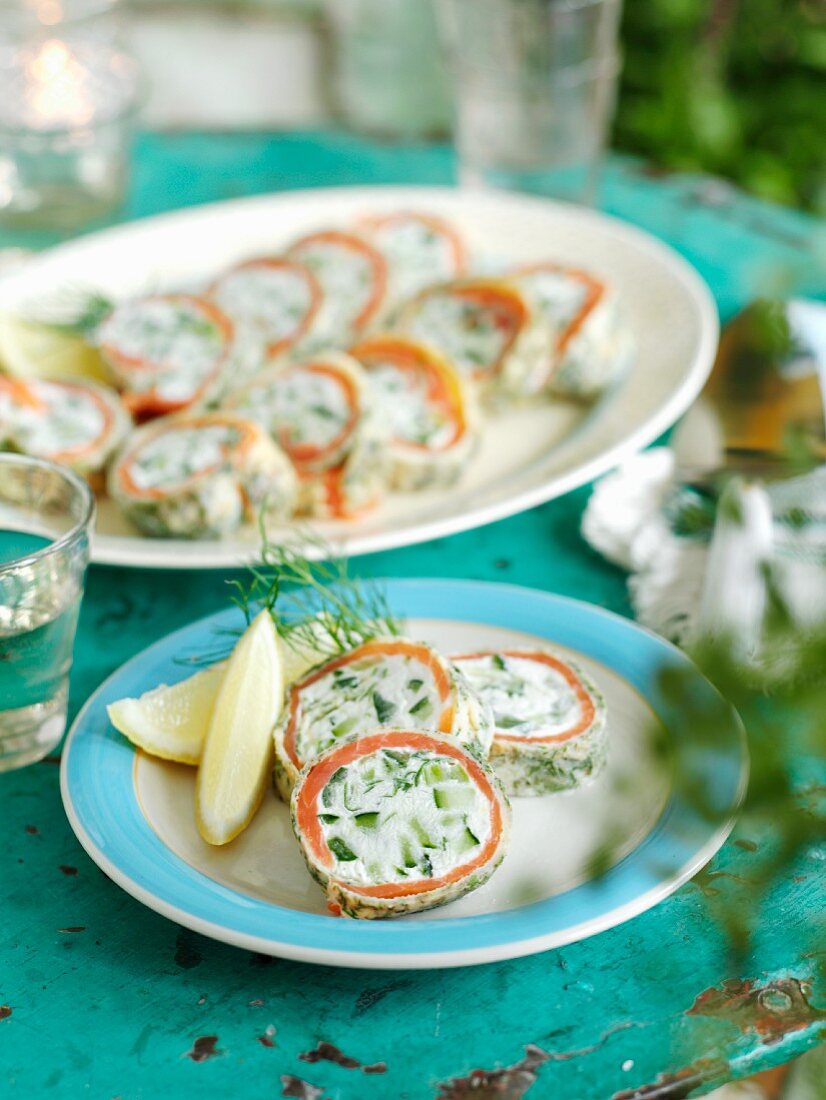 Pancake rolls filled with smoked fish, fresh cheese, cucumbers and dill