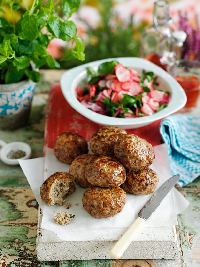 Spicy meatballs with a radish and watercress salad