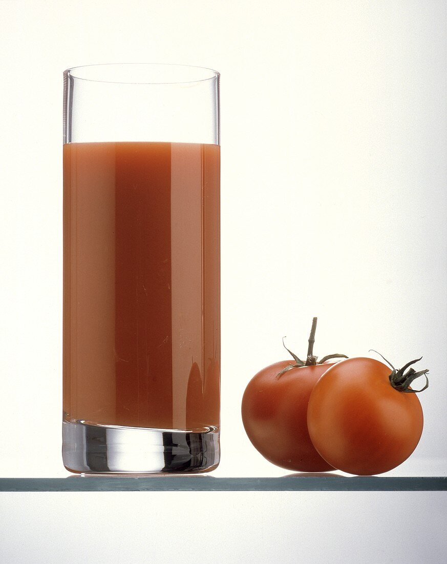 Tall Glass of Tomato Juice with Tomatoes