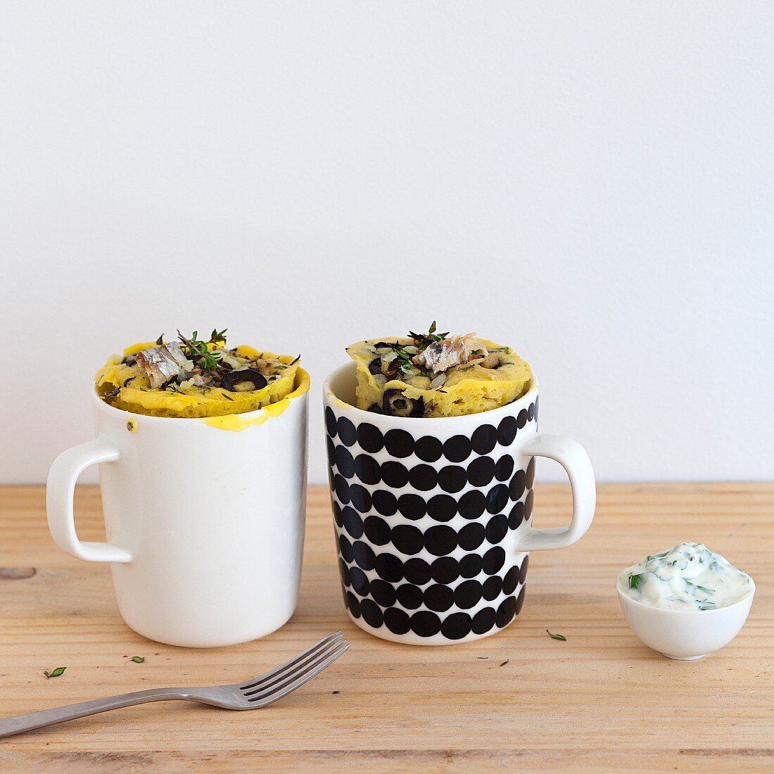 Savoury mug cakes with sardines, onion and olives