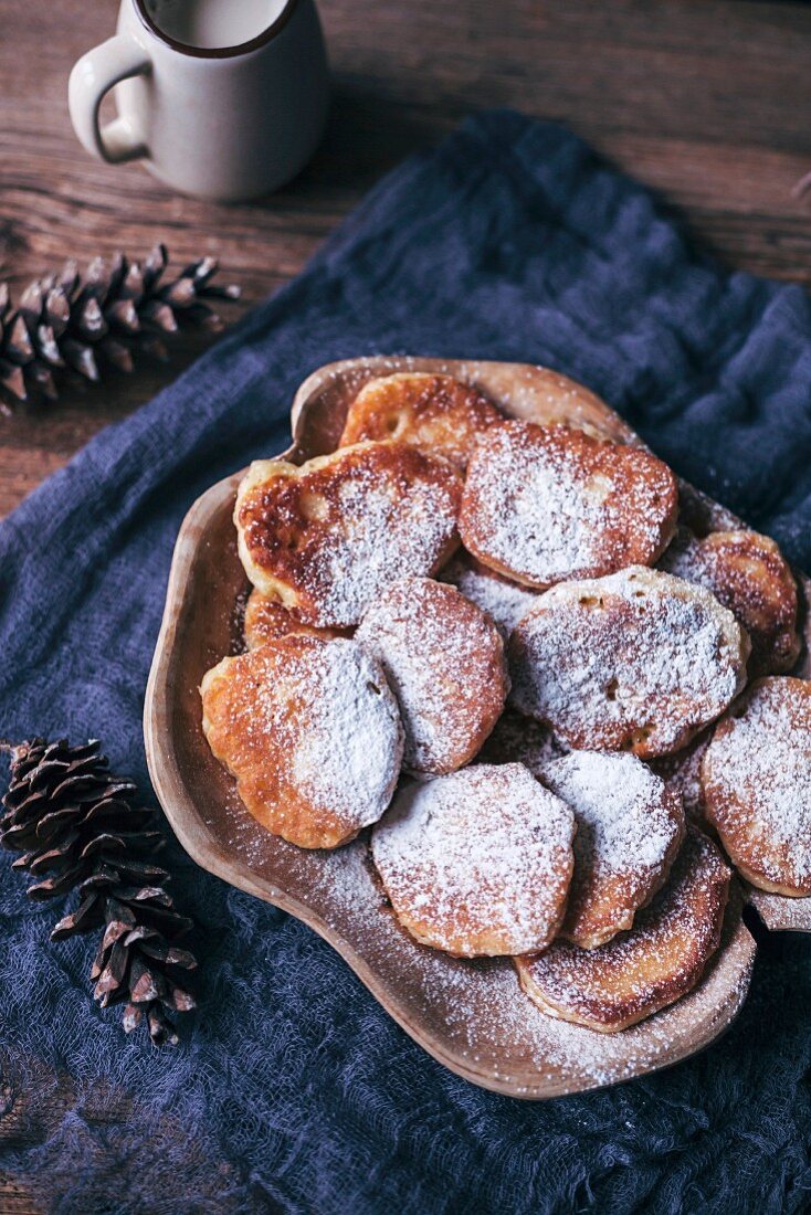 Sweet fritters dusted with powdered sugar