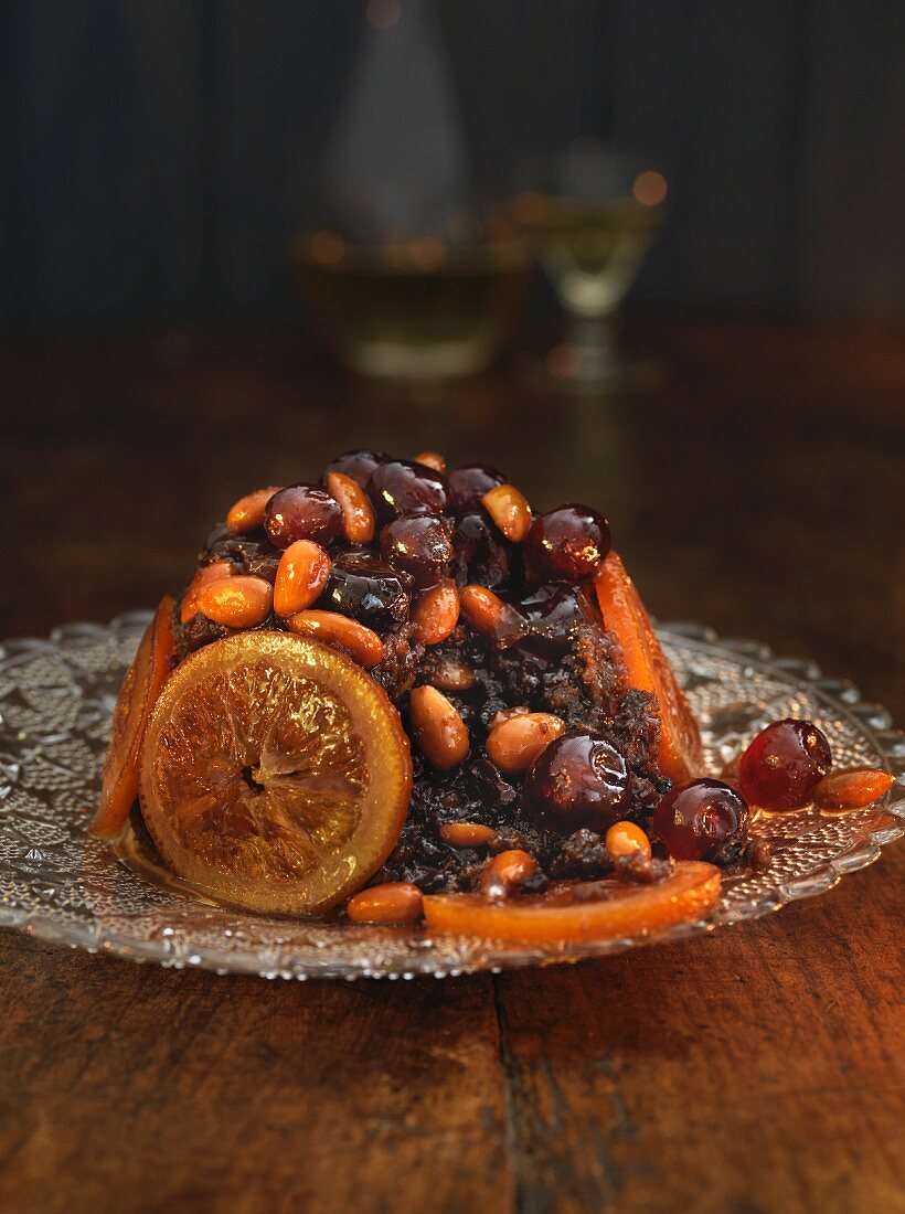 Christmas pudding with candied fruits and almonds