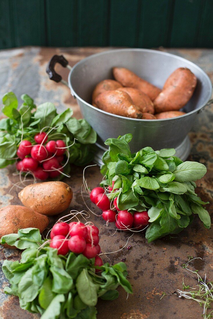 Fresh sweet potatoes and radishes
