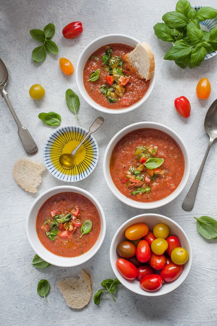 Gazpacho soup with salsa, basil and olive oil