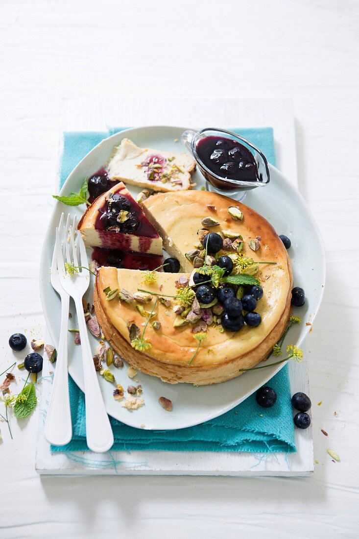 Baked ricotta, honey and yoghurt tart with blueberry and balsamic sauce