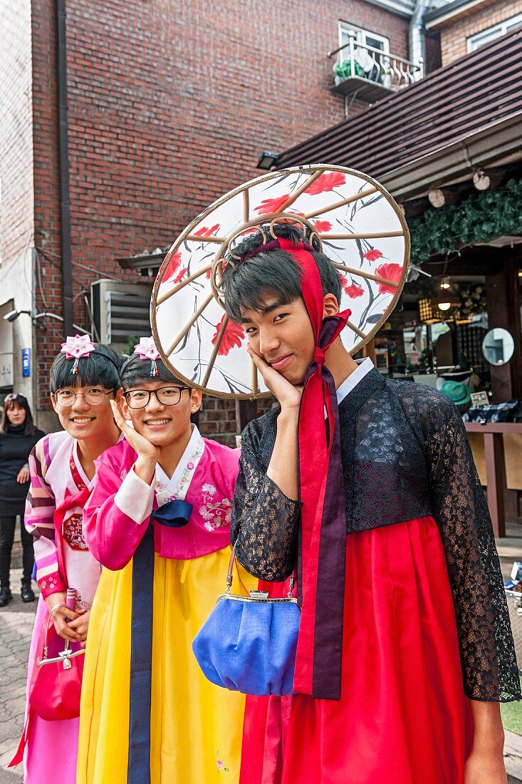 Young Korean males wearing women's clothing in Bukchon Hanok Village, Seoul, South Korea