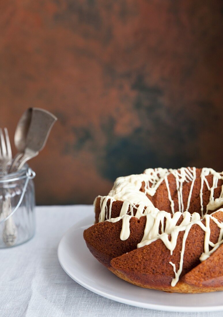 A ring-shaped Bundt cake with white chocolate