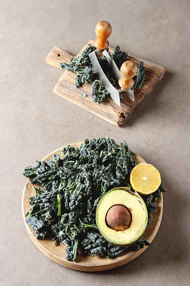 Fresh leaves of Kale salad with avocado, and lemon, Italian Cuisine