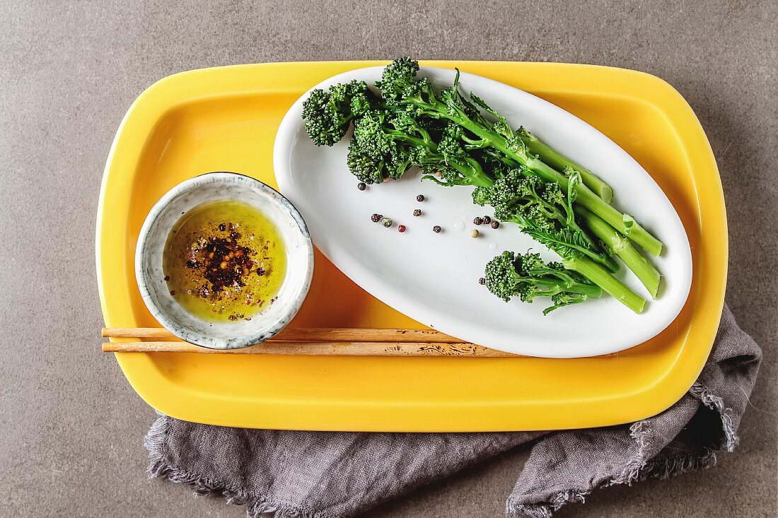 Cooked purple broccoli with olive oil and spices