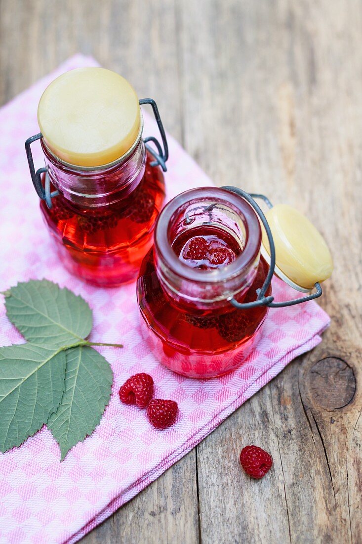 Homemade raspberry vinegar in flip-top bottles
