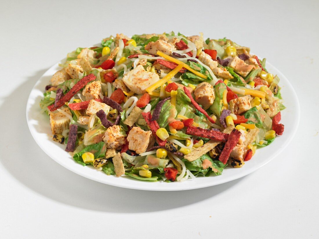 Southwest chicken salad with sweetcorn, salami and red and yellow pepper (USA)