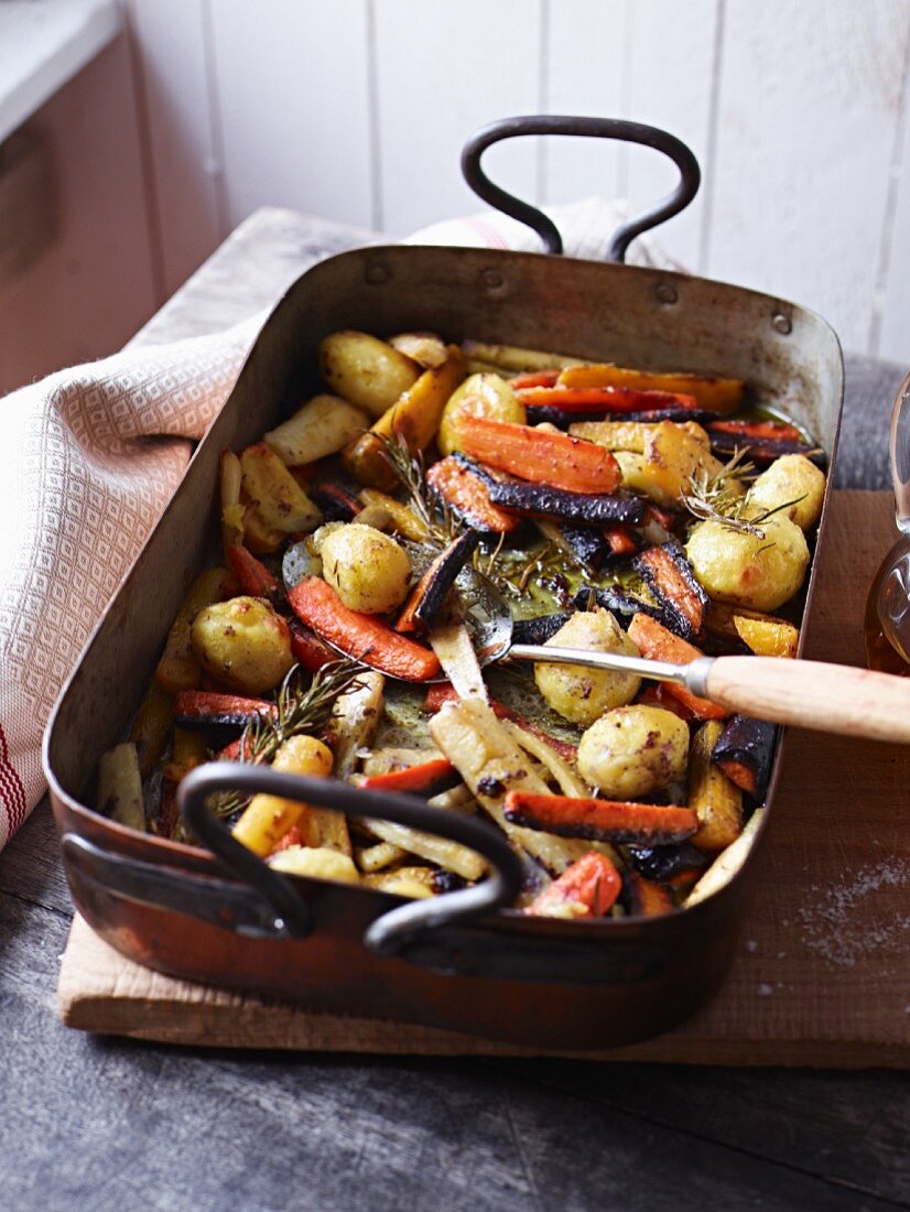 Oven-roasted vegetables in a roasting tin